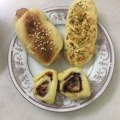 A picture of Fresh from the oven - Chicken Sausage Roll, Garlic Bread and Cinnamon Rolls.