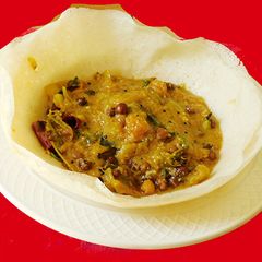 A picture of Appam with kadalai curry (chickpea masala curry).