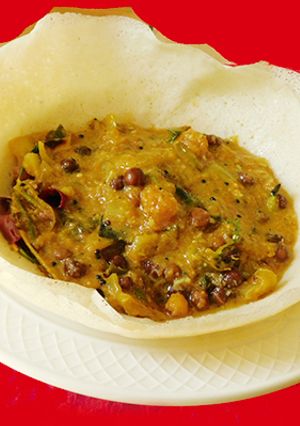 A picture of Appam with kadalai curry (chickpea masala curry).