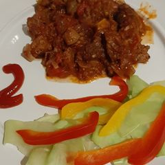 A picture of Fried beef and rice.