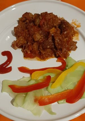 A picture of Fried beef and rice.