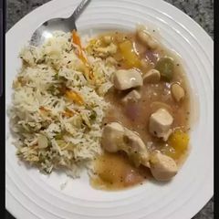 A picture of Almond chicken with fried rice.