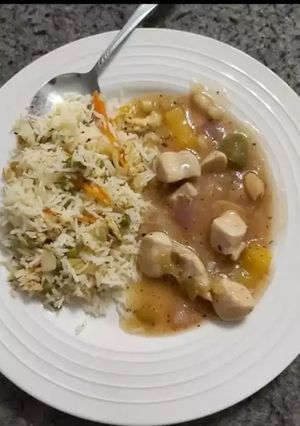A picture of Almond chicken with fried rice.