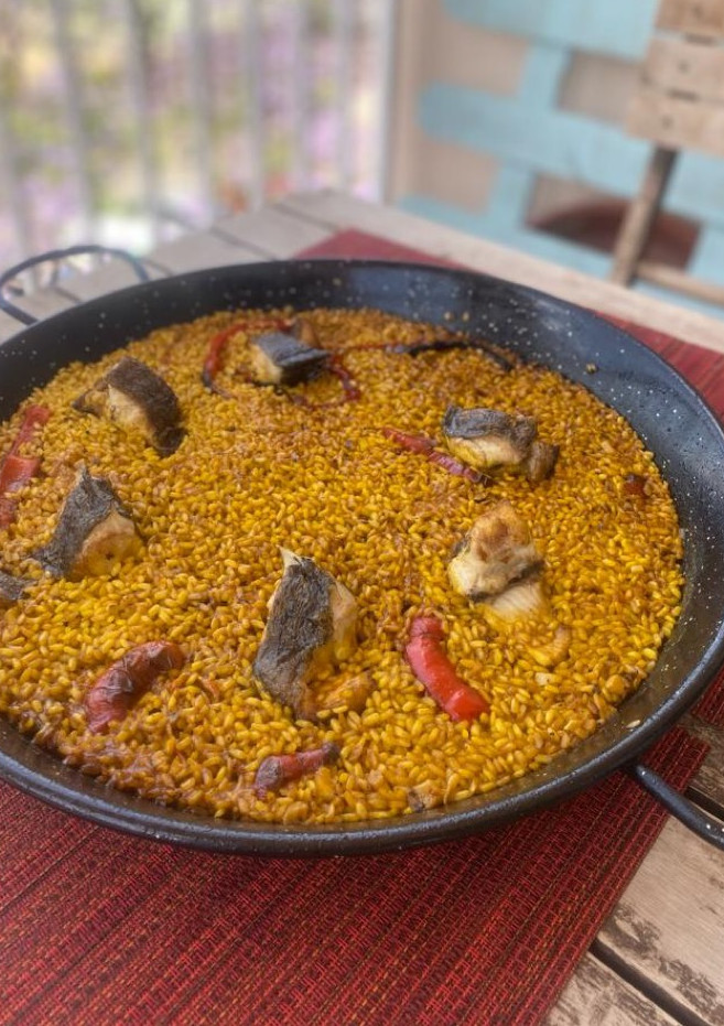 Una foto de Arroz con morena