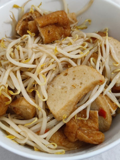 A picture of Sambal bean sprouts with fish cake and fried tofu puff.
