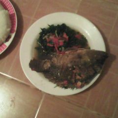 A picture of Stewed fish and kale.