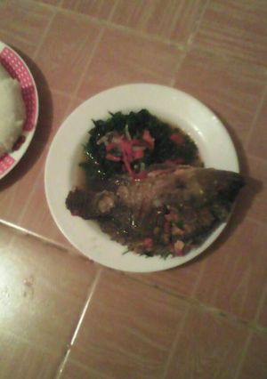 A picture of Stewed fish and kale.