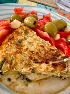 A picture of Zucchini Omelette Stuffed with Manchego Cheese.