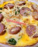 Tortilla abierta de espinacas, butifarra y queso con semillas de lino
