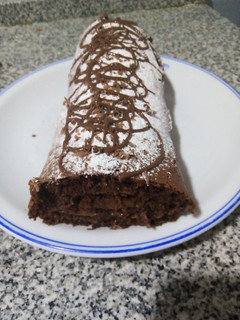 Una foto de Pionono de chocolate relleno dulce de leche