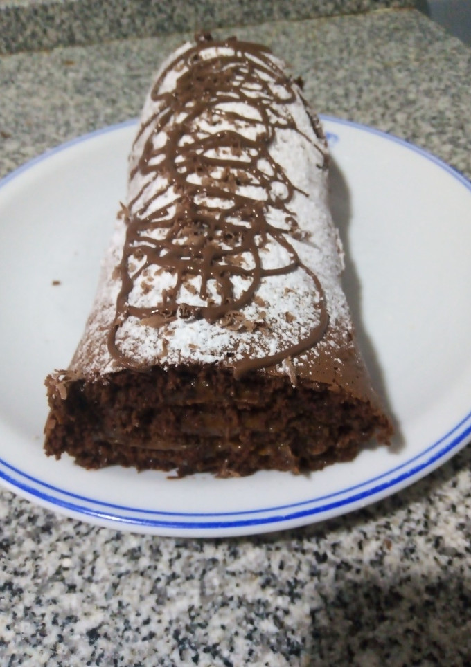 Una foto de Pionono de chocolate relleno dulce de leche