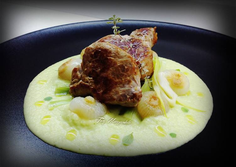 Medaglioni di maiale con crema di sedanorapa e zucchine, cipolline borettane e cipollotti