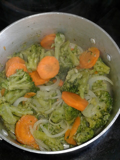 A picture of Broccoli with onion rings vegetable.