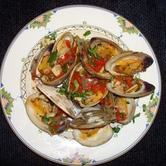 A picture of STEAMED CLAMS WITH TOMATOES AND CILANTRO. JON STYLE.