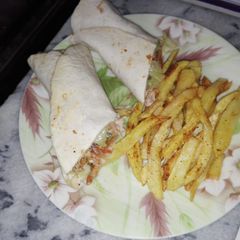 A picture of Mexican Chicken Fajitas Tortilla Wraps With Fries.
