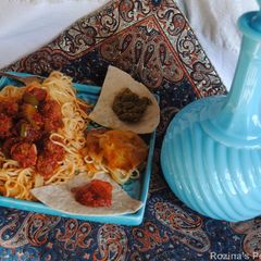 A picture of Persian style meatballs spaghetti.