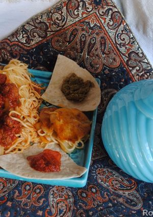 A picture of Persian style meatballs spaghetti.