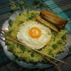 A picture of Egg Fried Rice with Baked Potato.