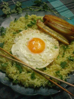 A picture of Egg Fried Rice with Baked Potato.