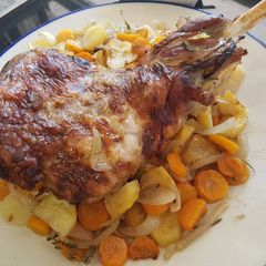 A picture of Leg of lamb roasted slowly in white wine and fresh herbs.