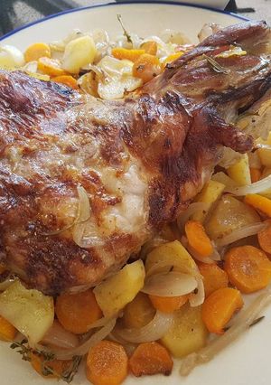 A picture of Leg of lamb roasted slowly in white wine and fresh herbs.