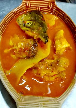 A picture of Southern Thai Sour Curry with Salmon Head and Pickled Bamboo Shoots.