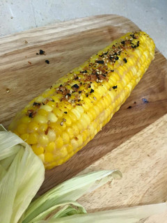 A picture of Miso Butter Corn with Togarashi and Furikake.