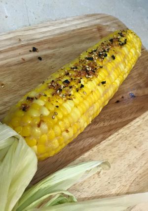 A picture of Miso Butter Corn with Togarashi and Furikake.
