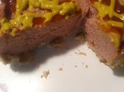 A picture of hotdog with ketchup