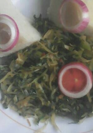 A picture of Ugali and mixed vegetables.