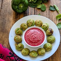 A picture of Spinach Appam with Beetroot Chutney.