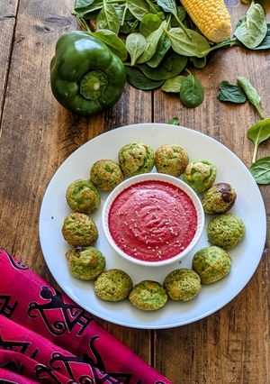 A picture of Spinach Appam with Beetroot Chutney.