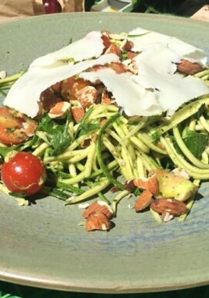 A picture of Pesto courgetti salad with feta and almonds.