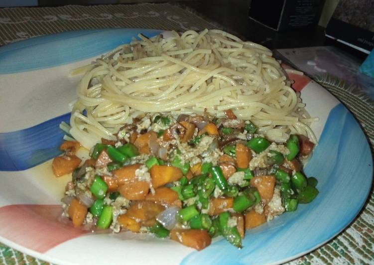 Spaghetti and veggie sauce with eggs
