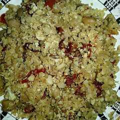 A picture of Couscous de Coliflor al curry con tomates secos.