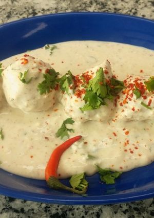 A picture of Moong daal balls in spicy curd.