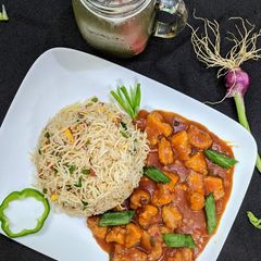A picture of Chicken Manchurian with Chinese Rice.