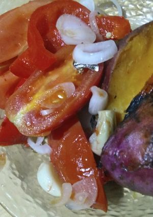 Una foto de Asado a la parrilla de paquetes de tomate