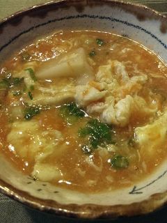 A picture of Carrot Egg Drop Soup with Mochi Rice Cake.