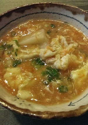 A picture of Carrot Egg Drop Soup with Mochi Rice Cake.