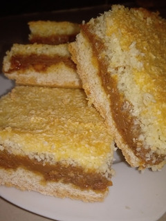 Una foto de Cuadrados de Coco y Dulce de leche