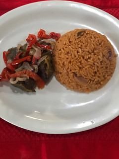A picture of Jellof rice and pepper beef.