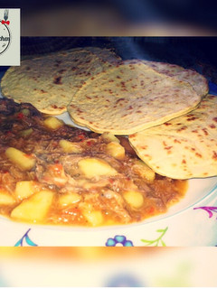A picture of Roti with shredded chicken soup.