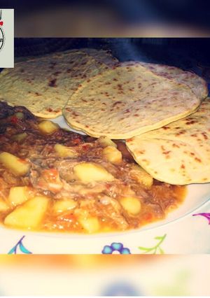 A picture of Roti with shredded chicken soup.