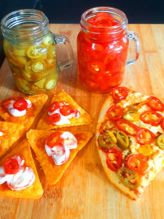 A picture of Pickled red and green Jalapeno.