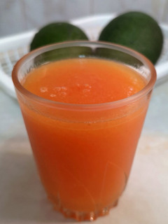 Una foto de Jugo surtido de papaya y tangelo