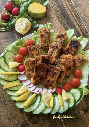 A picture of Fish Fingers with cut salad.