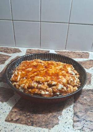 Una foto de Postre de vainillas marmolada relleno con crema de harina y caramelo