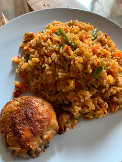 A picture of Nigerian Jollof Rice and Grilled Chicken.