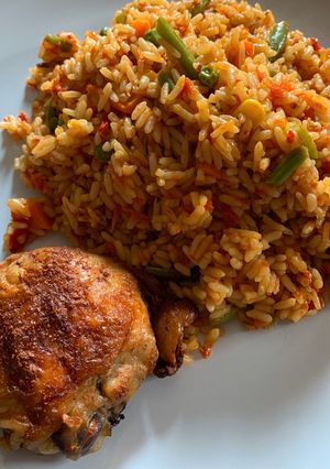 A picture of Nigerian Jollof Rice and Grilled Chicken.